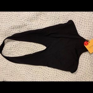 One piece reversible bathing suit